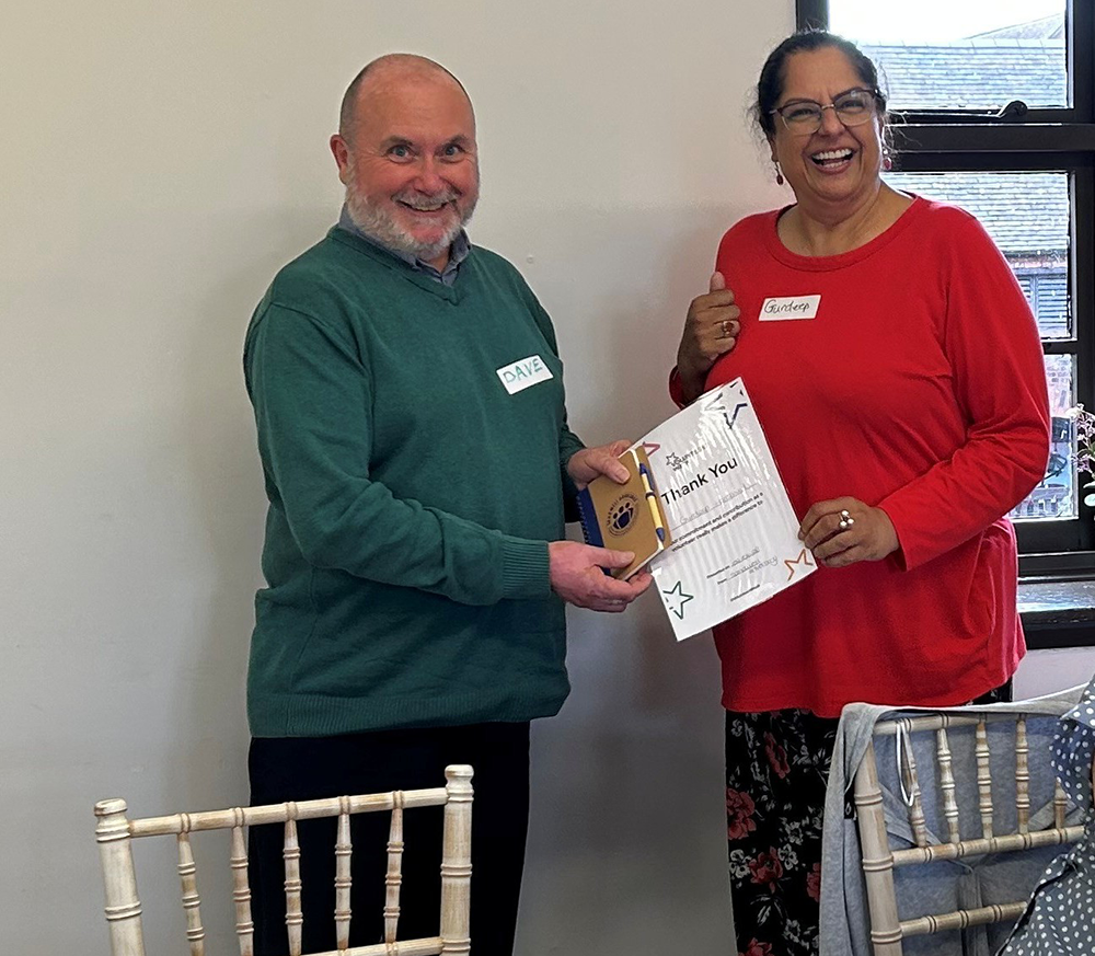 Dave and Gurdeep with thank you certificate